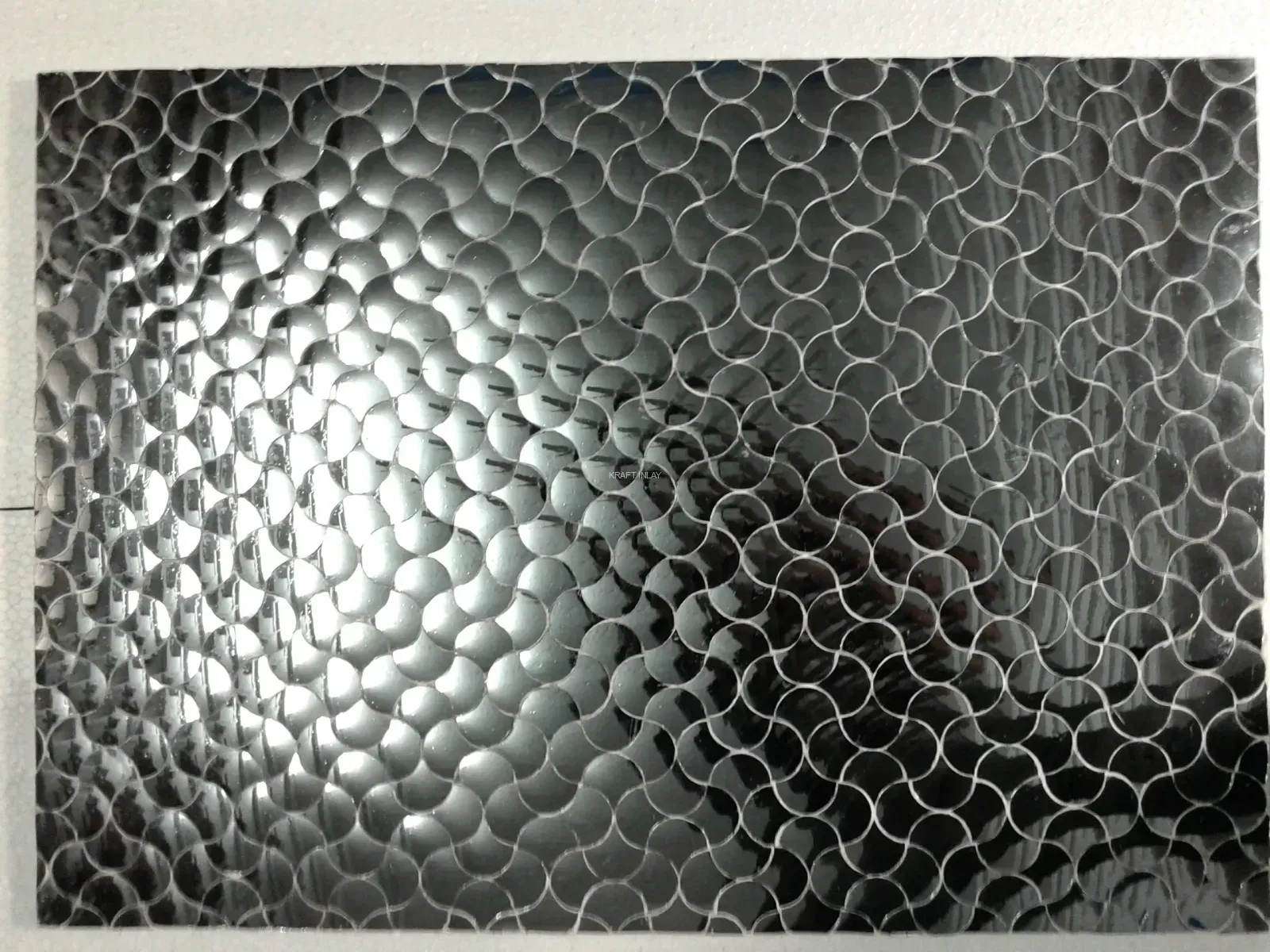Handcrafted silver Thikri mirror work wall tile featuring an elegant fish scale (scallop) pattern. Perfect for luxury interior accents.