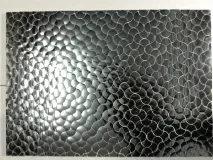 Handcrafted silver Thikri mirror work wall tile featuring an elegant fish scale (scallop) pattern. Perfect for luxury interior accents.