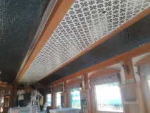 Exquisite Thikri glass inlay meticulously handcrafted onto a vaulted ceiling, reflecting the timeless heritage of Rajasthani artistry.