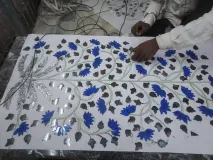 Bringing heritage to life. Watch the intricate process of creating our signature blue glass lotus and silver mirror vine Thikri artwork.