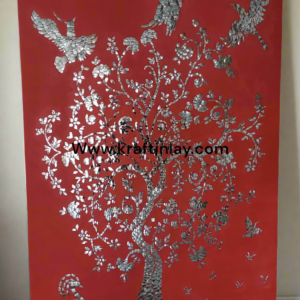 Handcrafted Thikri mirror art wall panel featuring a floral tree design on a vibrant red base.