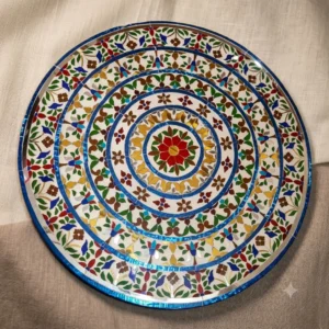 Handcrafted round colorful stained glass and mirror inlay tabletop featuring intricate floral mosaic artwork.